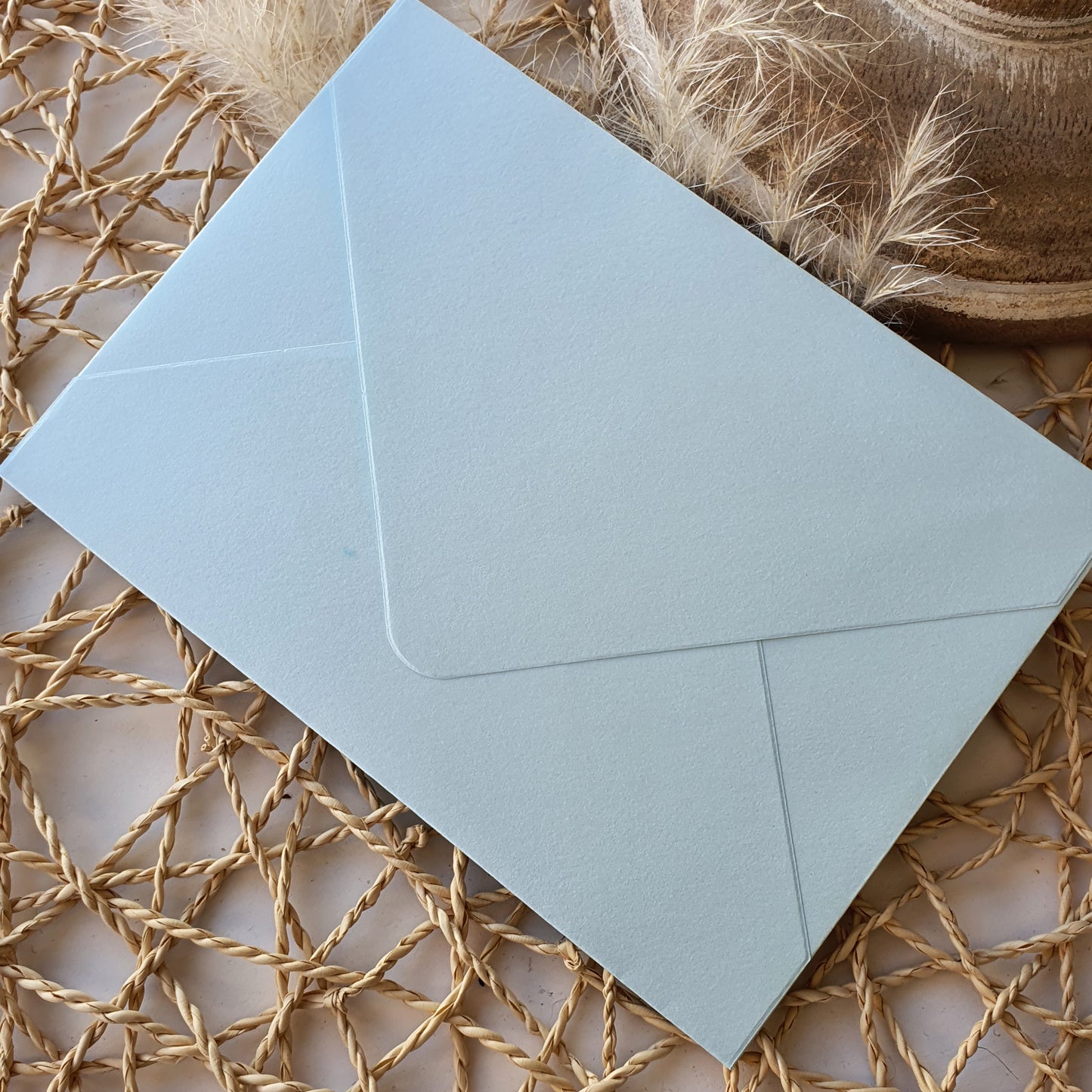 Envelope azul celeste com brilho