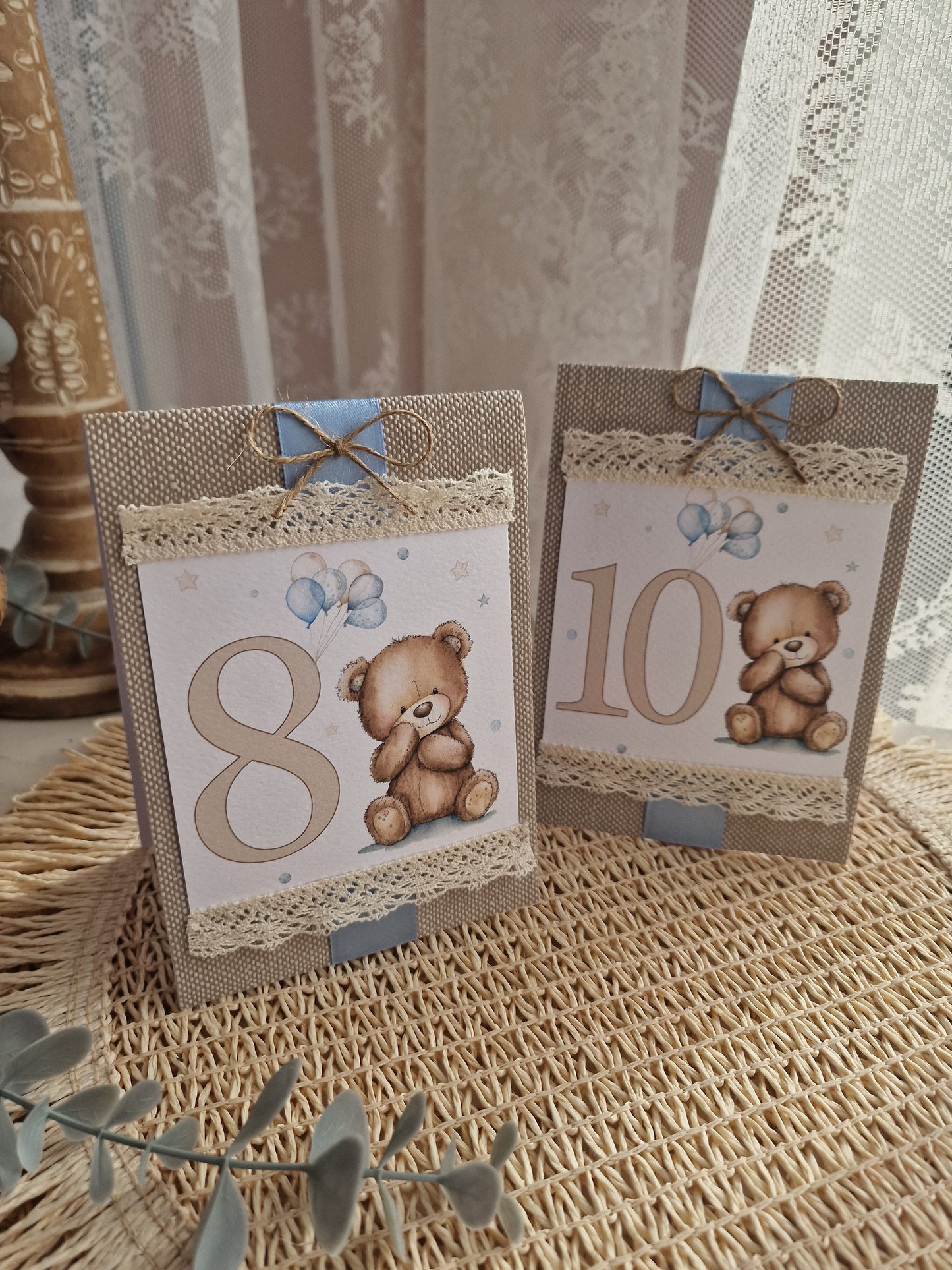 Blue teddy bear table marker with base